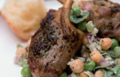 Marinated lamb cutlets with pea and minted yoghurt salad