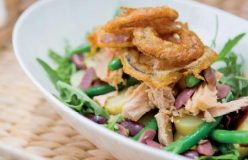 Tuna, olive and potato salad with deep-fried onion rings