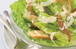 Spring salad with cos lettuce, asparagus and crisp prosciutto with a poached egg dressing