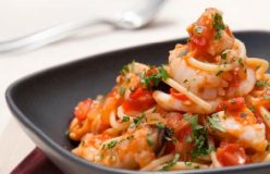 Spaghetti with seafood, fresh tomato and parsley sauce