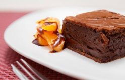 Chocolate slice with poached mandarins and chocolate sauce