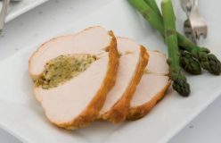 Roast turkey breast with macadamia and herb stuffing and steamed asparagus